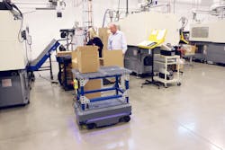 Metro Plastics President Ken Hahn examines a box of finished products delivered by the MiR200 autonomous mobile robot. Metro Plastics President Ken Hahn examines a box of finished products delivered by the MiR200 autonomous mobile robot.