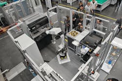 A production cell featuring a fully automated Freeformer 300-3X 3-D printer and a six-axis Kuka robot. A production cell featuring a fully automated Freeformer 300-3X 3-D printer and a six-axis Kuka robot.