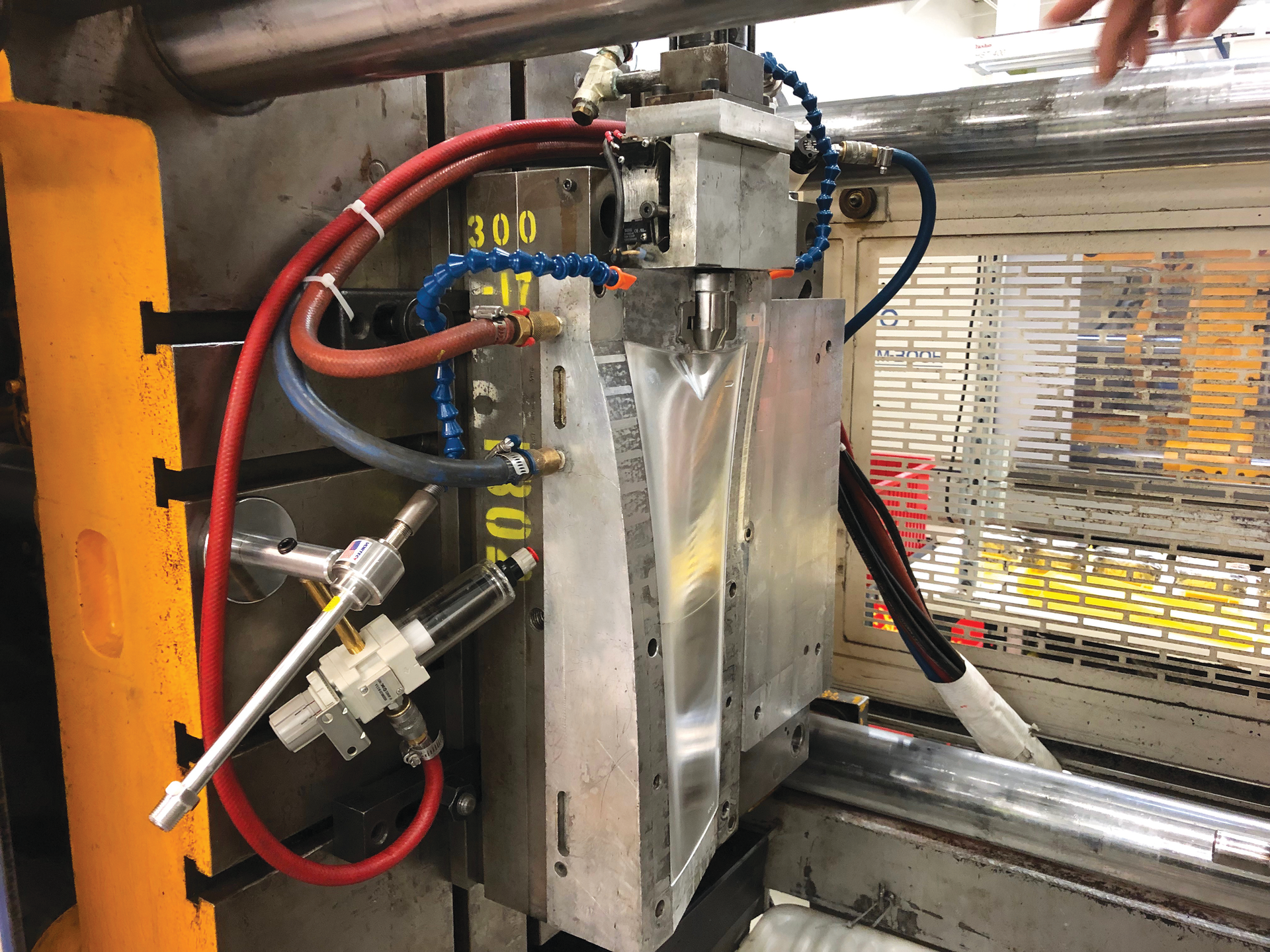 With vortex tubes mounted outside a mold, a compressed air line can blast cold air at specific portions of the mold to cool down large core sections when the mold is open.