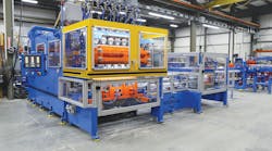 The RS-90 extrusion blow molding machine equipped with the VT-3 deflash automation package.
