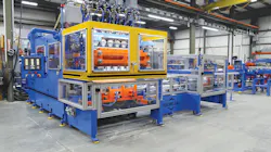 The RS-90 extrusion blow molding machine equipped with the VT-3 deflash automation package.
