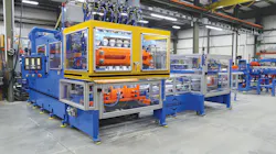 The RS-90 extrusion blow molding machine equipped with the VT-3 deflash automation package.