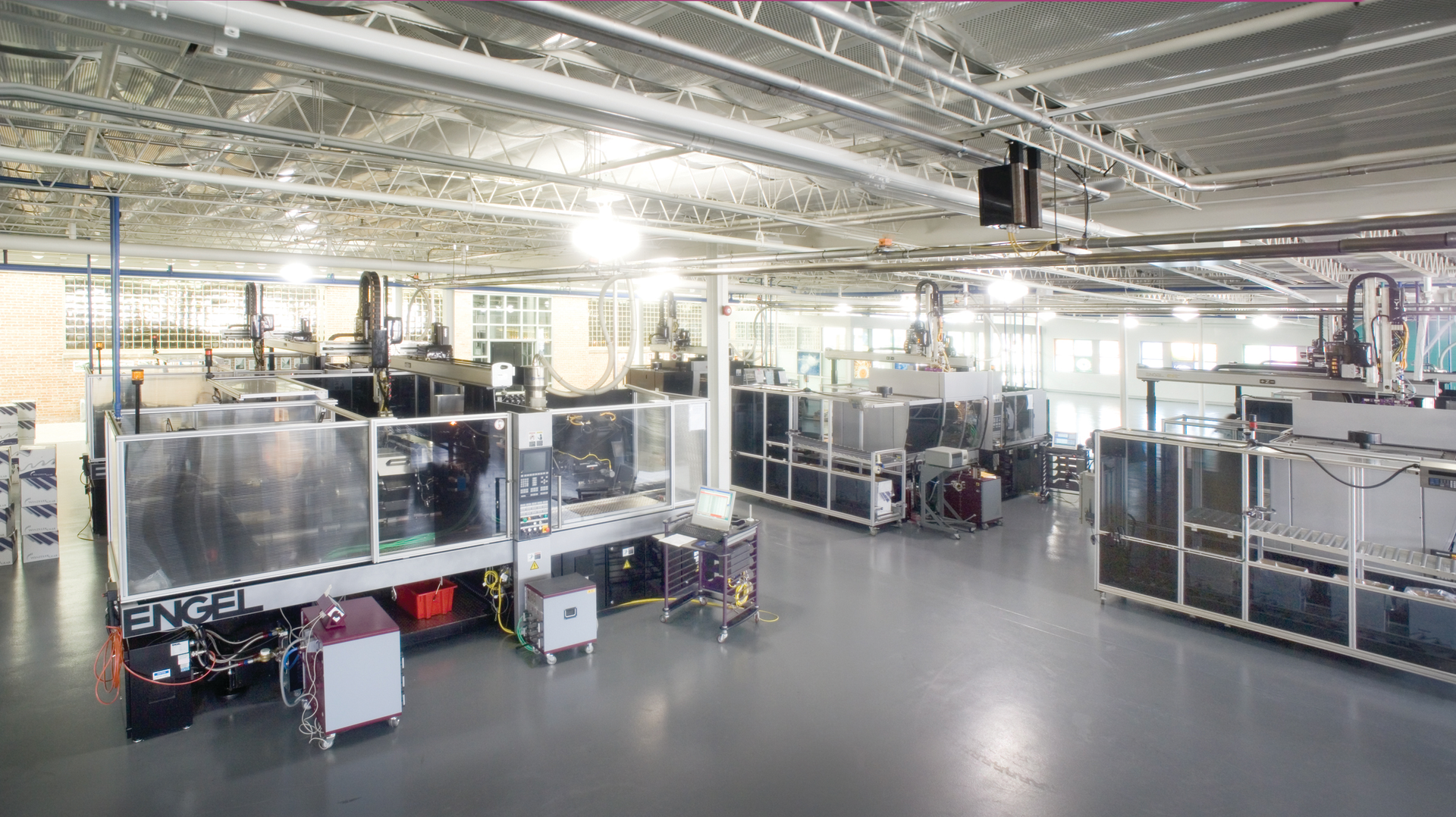 Injection molding cells on the shop floor of Winzeler Gear&rsquo;s Harwood Heights, Ill., facility
