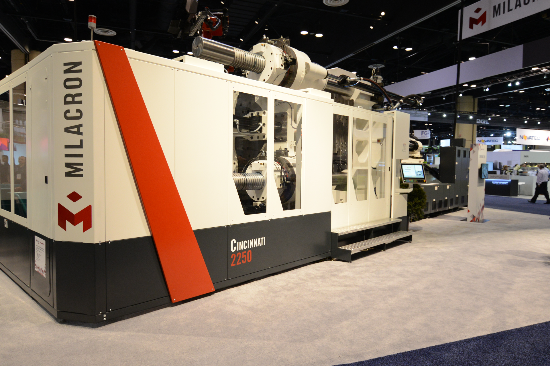 Milacron, a maker of injection presses, extruders and auxiliary systems, as well as molds, has been sold to Hillenbrand, the owner of Coperion. One of Milacron's presses is displayed at its NPE2018 booth.