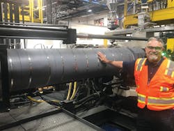 Pelican Products’ Gabe Guerra touches a TCS radiant heater to illustrate its safety. Doing this on a traditional heater band would cause a severe burn. Pelican Products’ Gabe Guerra touches a TCS radiant heater to illustrate its safety. Doing this on a traditional heater band would cause a severe burn.