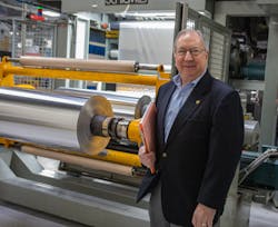 Len Czuba with a roll stack system. Len Czuba with a roll stack system.