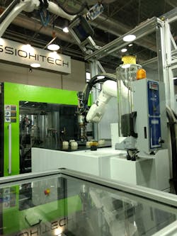 Yizumi Germany's new additive manufacturing system combines an extrusion head and a six-axis robotic arm. Yizumi Germany's new additive manufacturing system combines an extrusion head and a six-axis robotic arm.