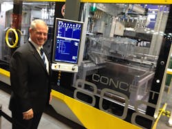 Bekum's Steve London shows off the company's Concept 808 extrusion blow molding machine, which showcases many of the features the company hopes to launch on its machines of the future. Bekum's Steve London shows off the company's Concept 808 extrusion blow molding machine, which showcases many of the features the company hopes to launch on its machines of the future.