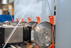 At Entek International, a company-built system transports trim material to a reprocessing station where it is turned back into pellets before being reused. At Entek International, a company-built system transports trim material to a reprocessing station where it is turned back into pellets before being reused.