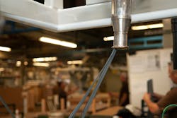 At Entek International, a company-built system transports trim material to a reprocessing station where it is turned back into pellets before being reused. At Entek International, a company-built system transports trim material to a reprocessing station where it is turned back into pellets before being reused.