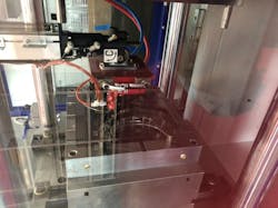 A Wittmann Battenfeld robot starts its approach into the mold area while the mold is opening using SmartRemoval technology, which reduces the time Pragmatic Manufacturing needs for each production cycle for a facemask component. A Wittmann Battenfeld robot starts its approach into the mold area while the mold is opening using SmartRemoval technology, which reduces the time Pragmatic Manufacturing needs for each production cycle for a facemask component.