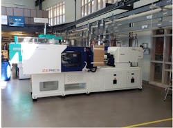 This compact 101-ton Zhafir Zeres ZE 900/210 is shown in place just after being brought into the Penn State Behrend plastics processing lab. This compact 101-ton Zhafir Zeres ZE 900/210 is shown in place just after being brought into the Penn State Behrend plastics processing lab.