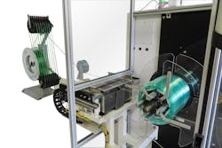 Conair Group's new coil strapping system for its ATC series tubing coiler Conair Group's new coil strapping system for its ATC series tubing coiler