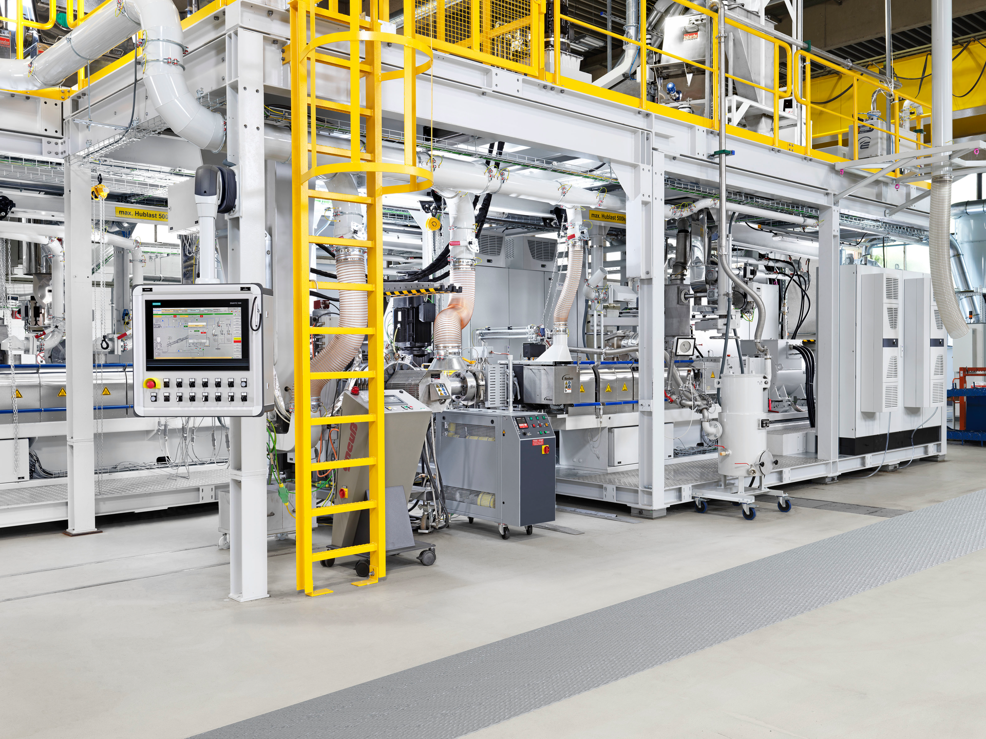 A new proprietary cutter-compactor unit is featured on a KraussMaffei demonstration line for compounding recycled postconsumer plastic.