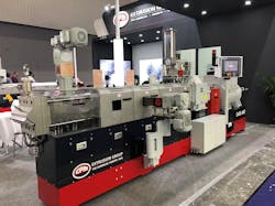 A CPM Extrusion extruder with a vertical vent stuffer A CPM Extrusion extruder with a vertical vent stuffer