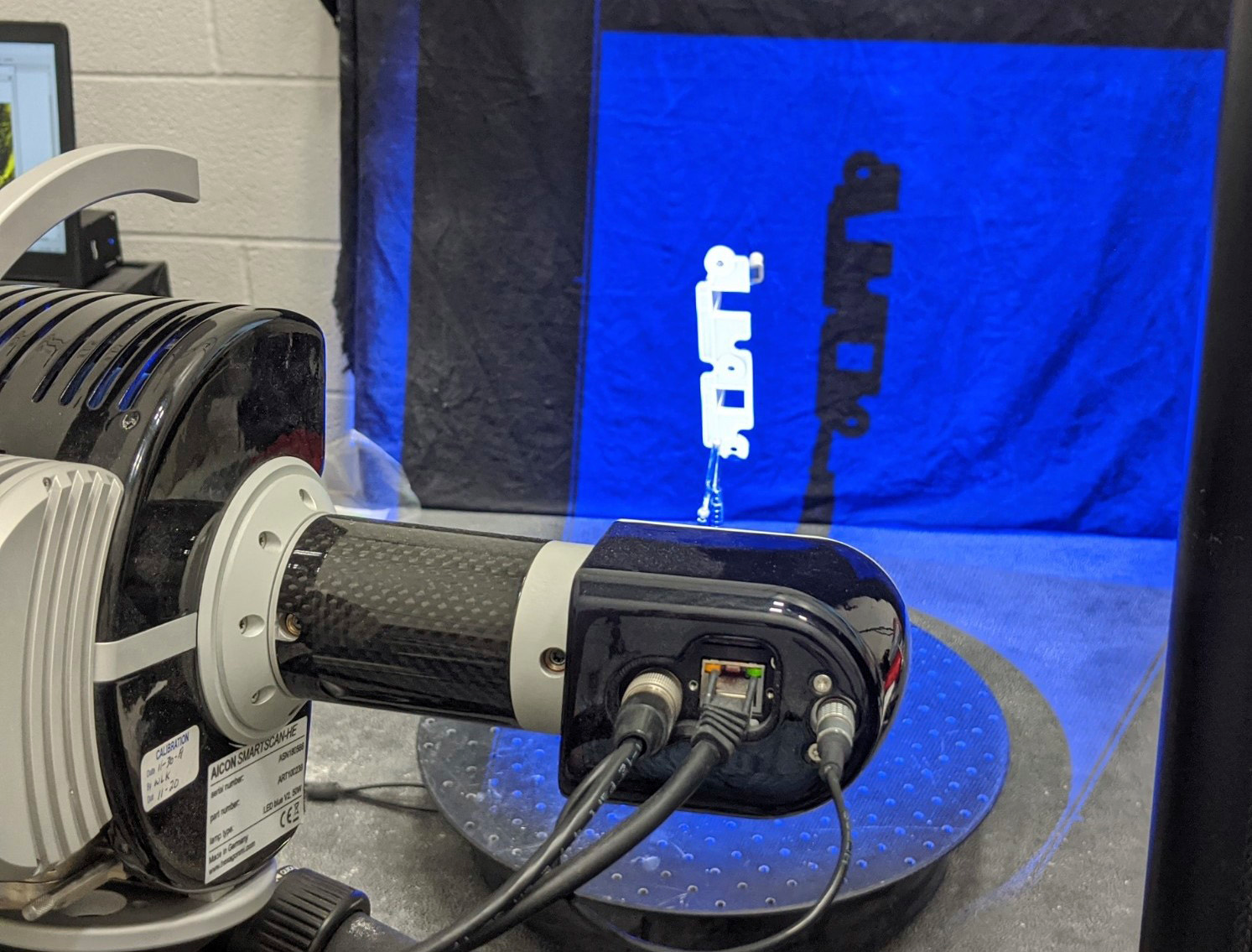 Ferriot&rsquo;s Aicon SmartScan scans an injection molded part using blue-light technology. Blue-light 3-D scanners offer better precision, accuracy and higher-quality outputs than white-light scanners, laser scanners and CMMs.