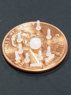 Matrix specializes in molding small parts, like these components. As an example, it recently completed a mold that used one pellet to produce 11 parts, each weighing 0.002 gram. In addition, it has molded parts with wall thicknesses as thin as 0.0029 inch and with a gate as small as 0.0037 inch in diameter. Matrix specializes in molding small parts, like these components. As an example, it recently completed a mold that used one pellet to produce 11 parts, each weighing 0.002 gram. In addition, it has molded parts with wall thicknesses as thin as 0.0029 inch and with a gate as small as 0.0037 inch in diameter.