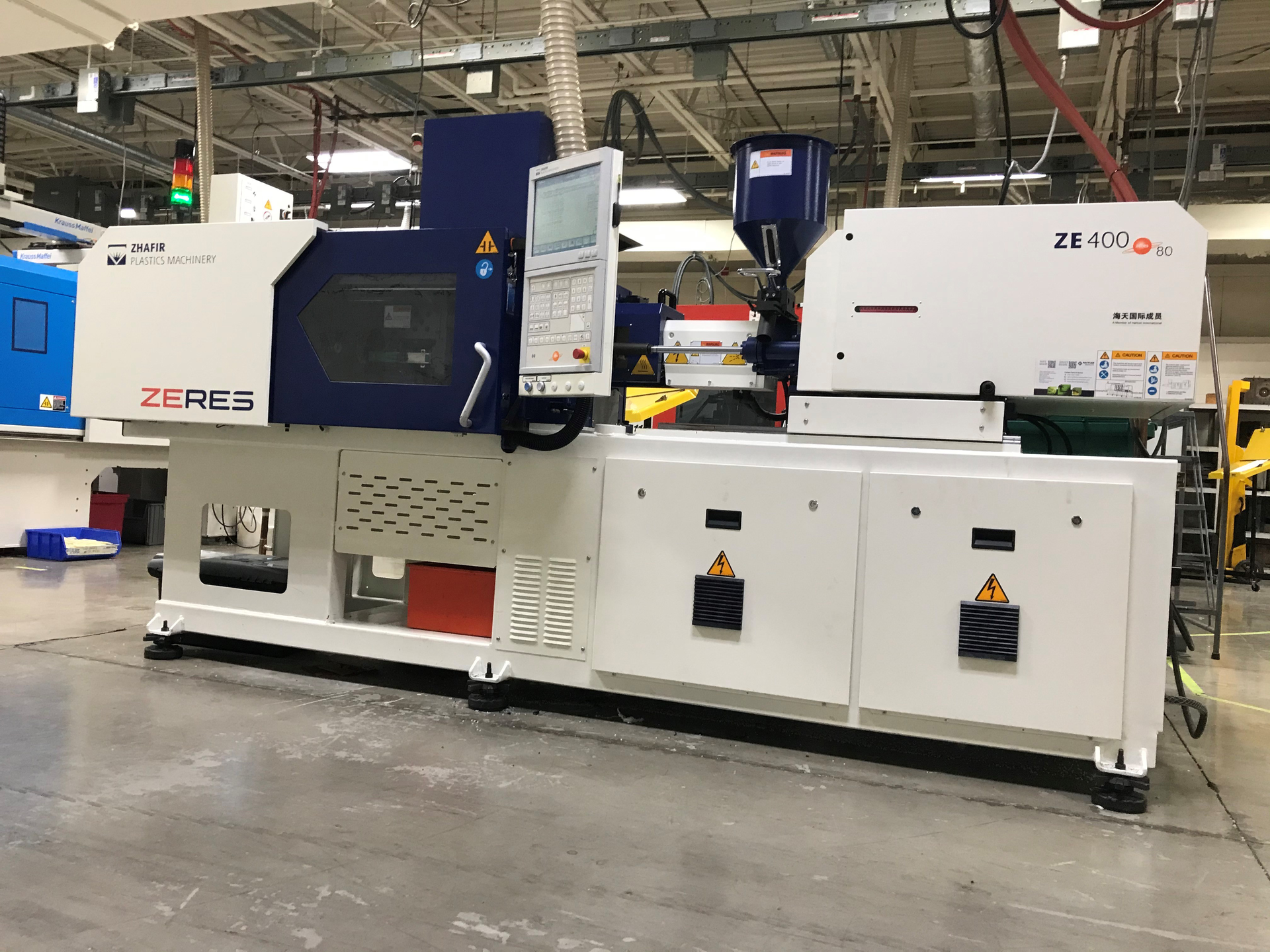 The ZE 400/120 is an electric machine complemented by a hydraulic circuit for injection carriage movement, core pull, ejectors and valve gates, which enables Ferris State students to view electric and servo hydraulic technology in one machine.