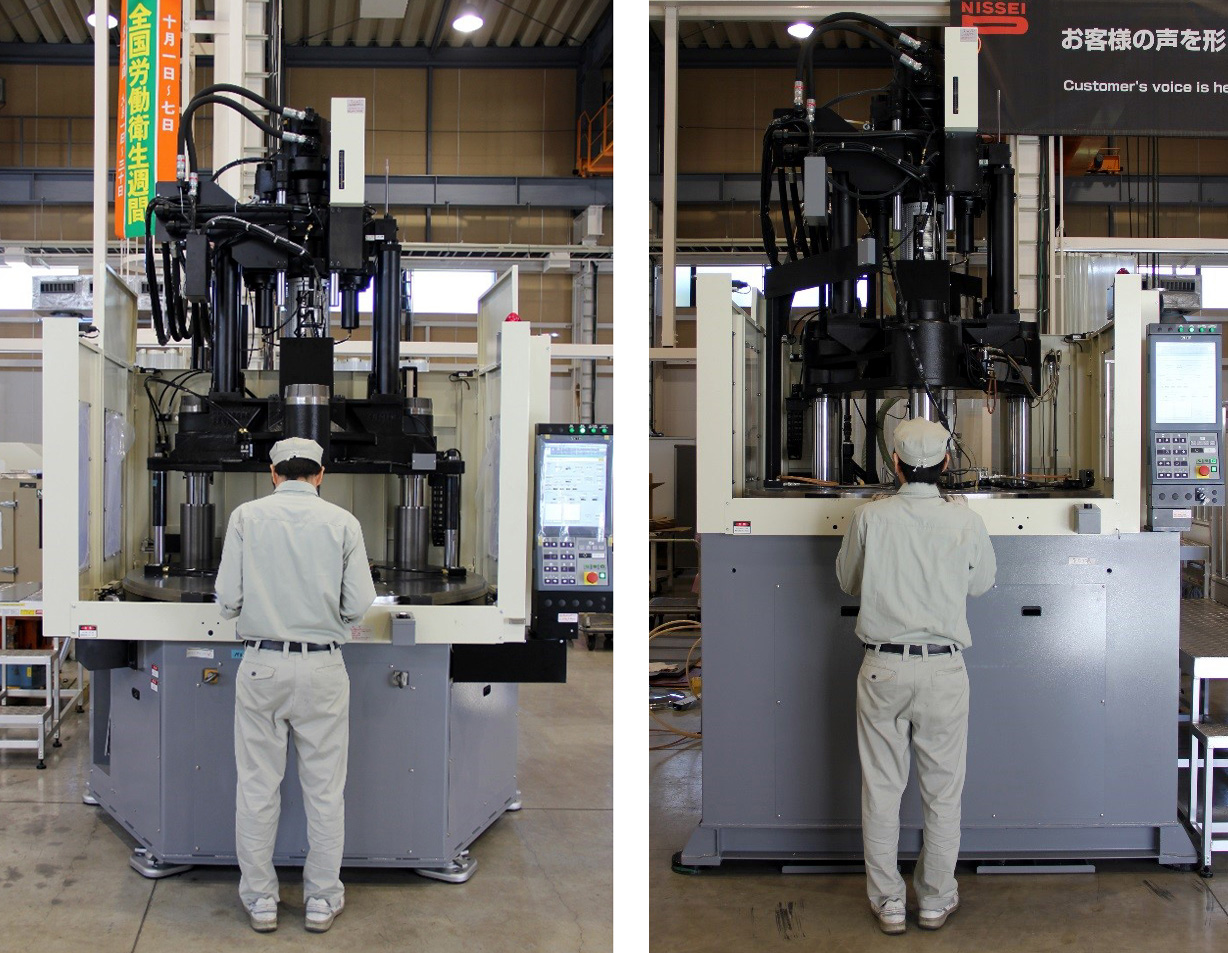 A worker, left, demonstrates the height advantages of Nissei's new 220-ton and 300-ton hybrid vertical injection molding machines.