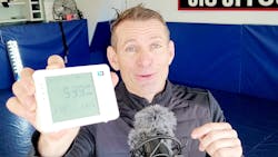Koz Galatsis shows off one of the carbon dioxide monitors available from his company, Forensics Detectors. A high level of carbon dioxide in the air is considered a risk factor for the potential of viral transmission.