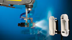 A Fanuc robot painting plastic parts