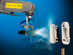 A Fanuc robot painting plastic parts A Fanuc robot painting plastic parts