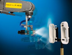 A Fanuc robot painting plastic parts A Fanuc robot painting plastic parts