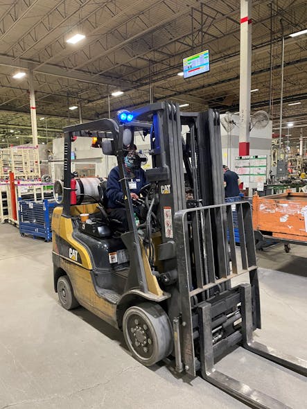 Blue whites provide a signal to passing workers to steer clear of approaching forklifts,