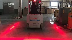 Red LED lights illustrate the area within a 2-foot radius around a forklift truck, limiting risk of collision.