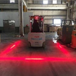 Red LED lights illustrate the area within a 2-foot radius around a forklift truck, limiting risk of collision. Red LED lights illustrate the area within a 2-foot radius around a forklift truck, limiting risk of collision.