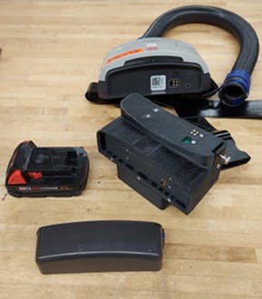 Replacement battery components for powered air-purifying respirators include a Milwaukee Tool m18 battery, a dual battery mount, an OEM battery and OEM blower with tube that connects to the helmet worn by health-care personnel.
