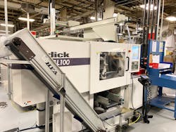 Viking Plastics&apos; stable of machines includes this Sodick GL100 molding machine coupled with Ranger Automation robot and insert handling.