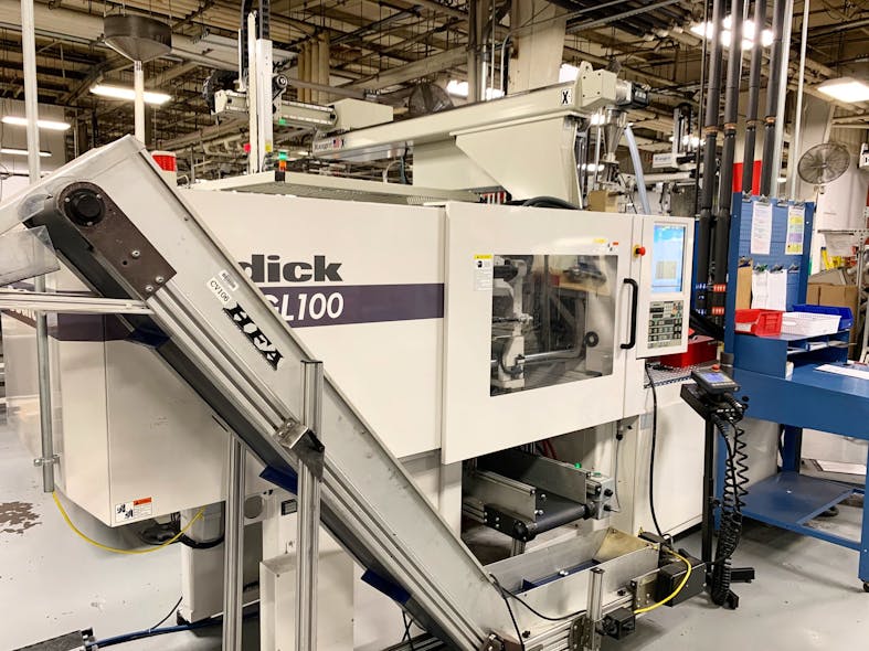 Viking Plastics&apos; stable of machines includes this Sodick GL100 molding machine coupled with Ranger Automation robot and insert handling.