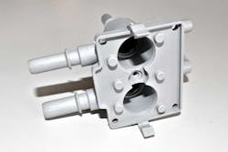Acromatic Plastics' products for the automotive industry include this molded valve housing. Acromatic Plastics' products for the automotive industry include this molded valve housing.