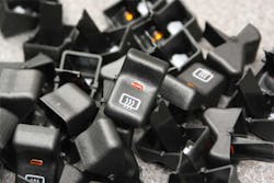 These buttons molded by Acromatic Plastics are destined for installation inside vehicles. These buttons molded by Acromatic Plastics are destined for installation inside vehicles.
