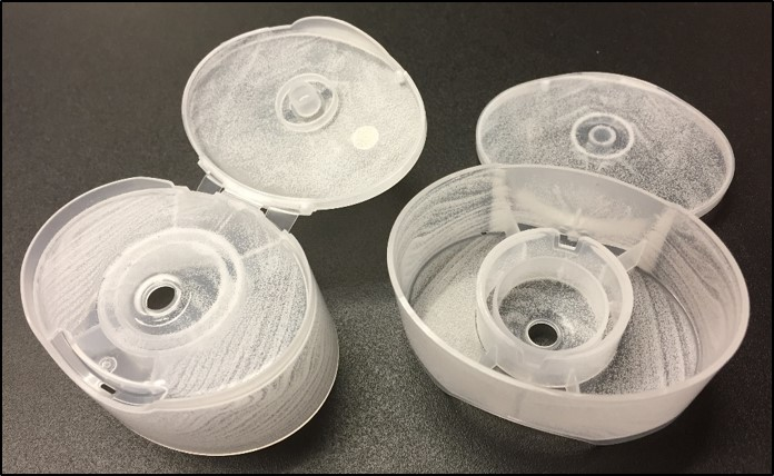 Add foaming agents, such as those in this cap tops, can make resin stretch a bit further for plastic parts makers looking to cut costs.