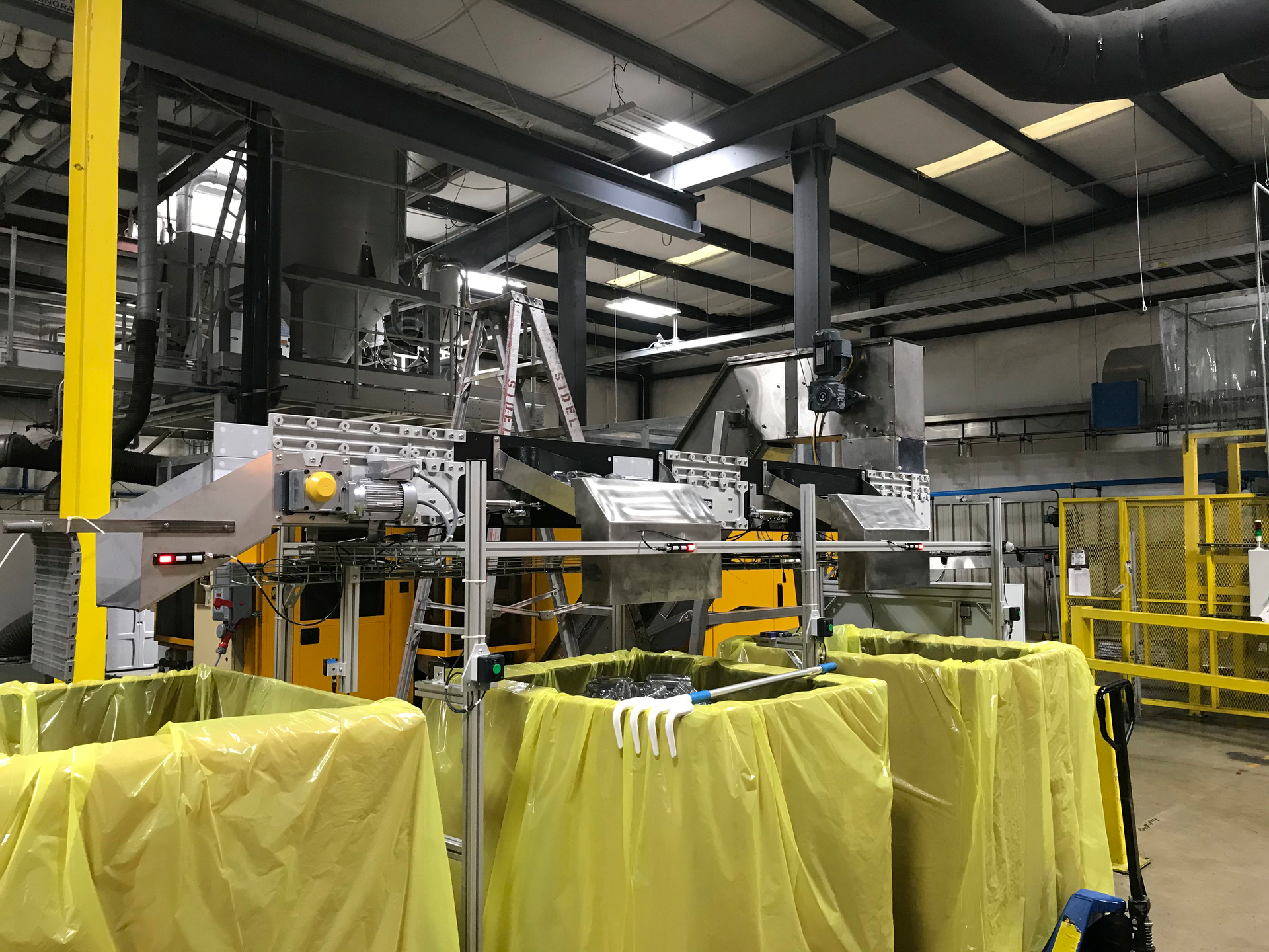 Dynamic Conveyor's plastic bottle preform conveyor can fill gaylords unattended for hours.