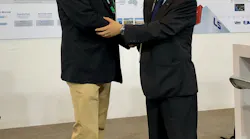 Peter Gardner, left, and LS Mtron's Howard Chung shake hands at NPE2018 to mark the original distribution deal.