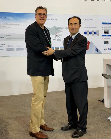 Peter Gardner, left, and LS Mtron&apos;s Howard Chung shake hands at NPE2018 to mark the original distribution deal.