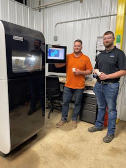 Chaz Winne, process engineer at PDS Plastics, left, works with Zack Demaray, head of operations, at the company's Arburg Freeformer. Chaz Winne, process engineer at PDS Plastics, left, works with Zack Demaray, head of operations, at the company's Arburg Freeformer.