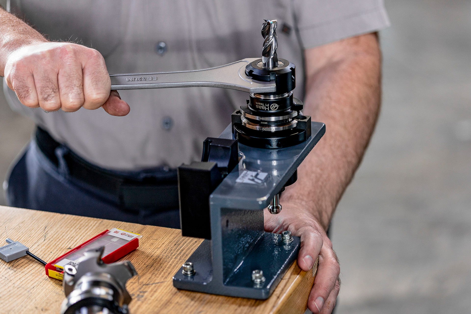 Haas&rsquo; toolholder fixture supports a toolholder securely and prevents it from rotating, leaving workers with both hands free to tighten or loosen collet nuts.