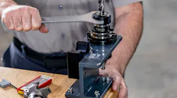 Haas’ toolholder fixture supports a toolholder securely and prevents it from rotating, leaving workers with both hands free to tighten or loosen collet nuts.