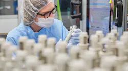 A Minnesota Rubber & Plastics employee looks over products.