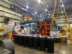 Eagle Manufacturing's Gary Byers, left, and Rocco Salatino pose with the new Davis-Standard SE 16540D blow molding system.