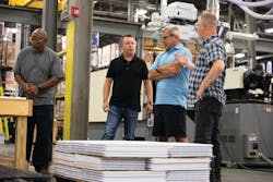 Members of Elevate's leadership team look over components of the sample kits the company makes and assembles for eye doctors' offices. Members of Elevate's leadership team look over components of the sample kits the company makes and assembles for eye doctors' offices.