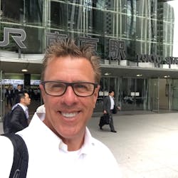 Peter Gardner stands outside a train station in Japan. As the business director of LS Mtron, the Mill Valley, Calif., resident now spends much of his time focused on South Korea.