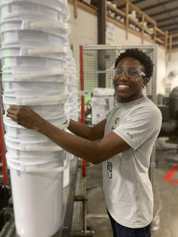 An M&M Industries employee stacks the company's pails. In a project with Engel and Top Grade Molds, M&M Industries has worked to optimize the post-consumer-resin core layer in pails it makes. The new pails, which could be used to package a variety of products, could hit the market soon. An M&M Industries employee stacks the company's pails. In a project with Engel and Top Grade Molds, M&M Industries has worked to optimize the post-consumer-resin core layer in pails it makes. The new pails, which could be used to package a variety of products, could hit the market soon.