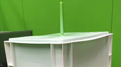 Engel's skinmelt process results in parts that have a recycled-material core, which is visible at the gate, as the green post-consumer recycled material is here.
