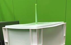 Engel's skinmelt process results in parts that have a recycled-material core, which is visible at the gate, as the green post-consumer recycled material is here. Engel's skinmelt process results in parts that have a recycled-material core, which is visible at the gate, as the green post-consumer recycled material is here.