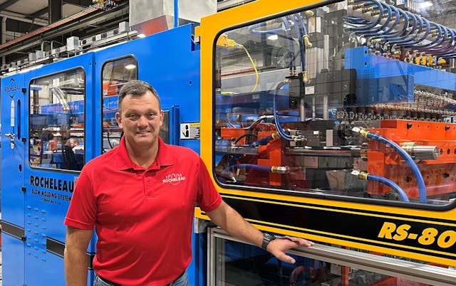 Steve Rocheleau with one of his company&apos;s extrusion blow molding machines.